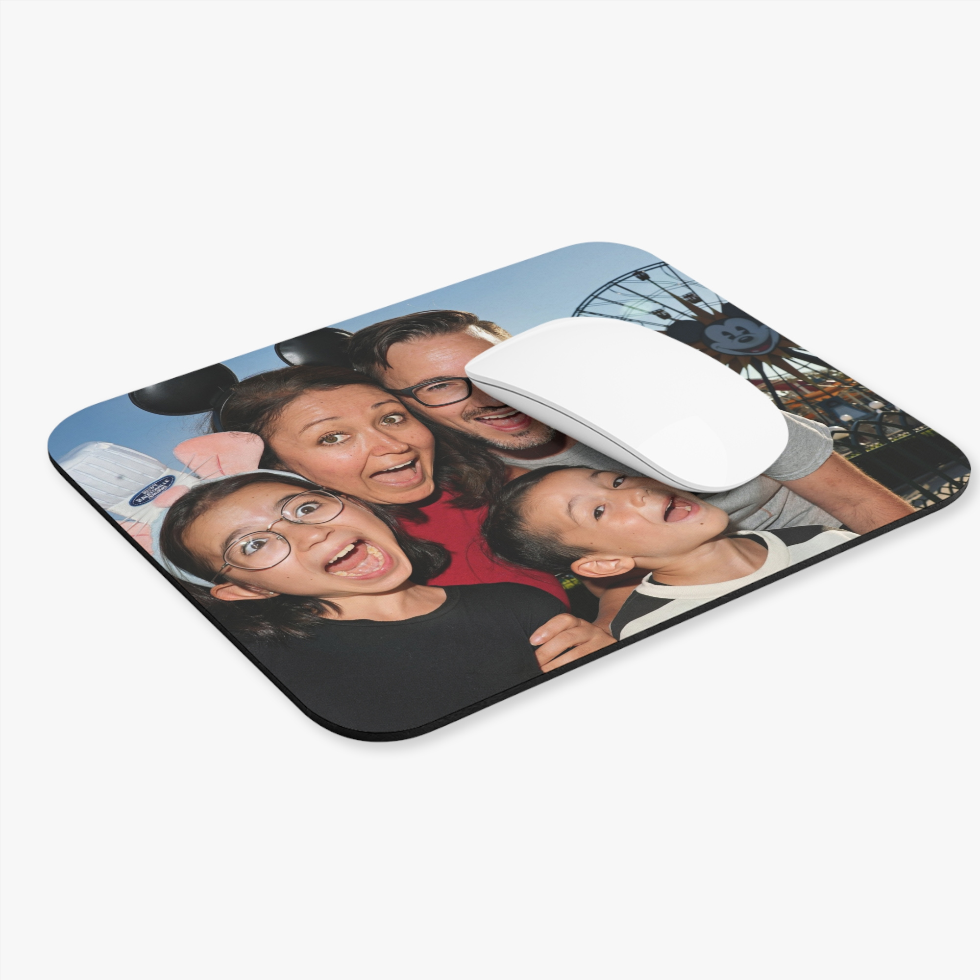 Custom mouse pad printed with a family photo from a theme park trip